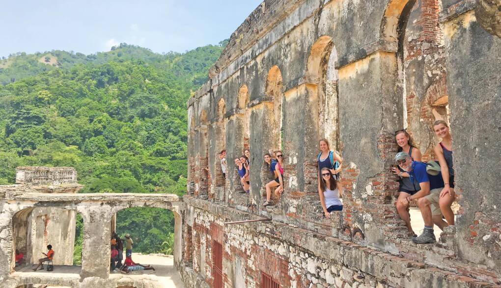 Students stand in a fortress in Haiti